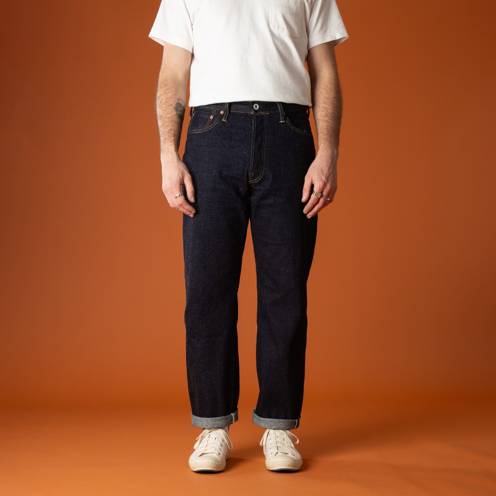 Selvedge jeans worn by urban wanderers, photographed frontally by DUBBLEWORKS.