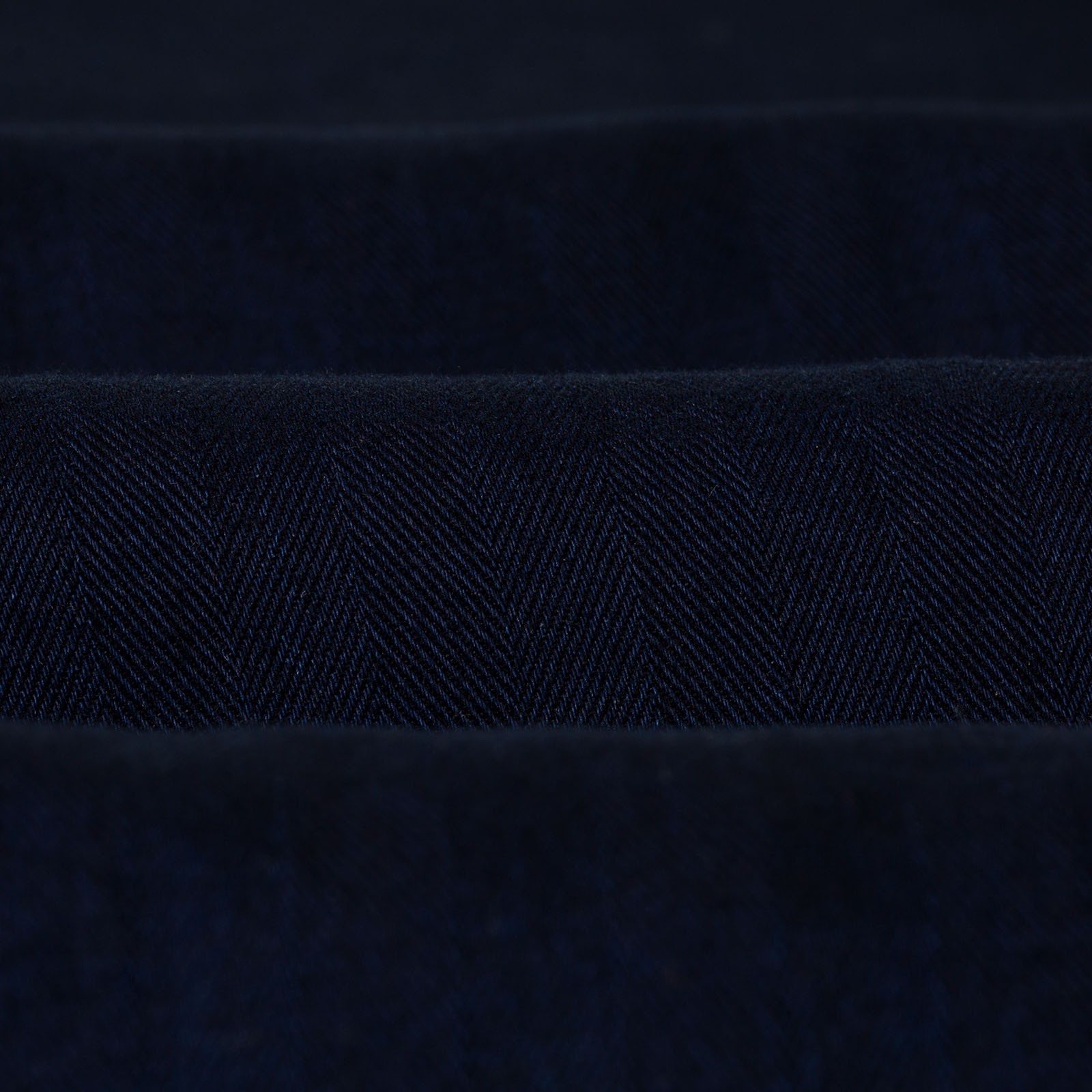 Image of strollers, detail of a noragi by UNIVERSAL WORKS, Kyoto Work Jacket in Indigo Herringbone.