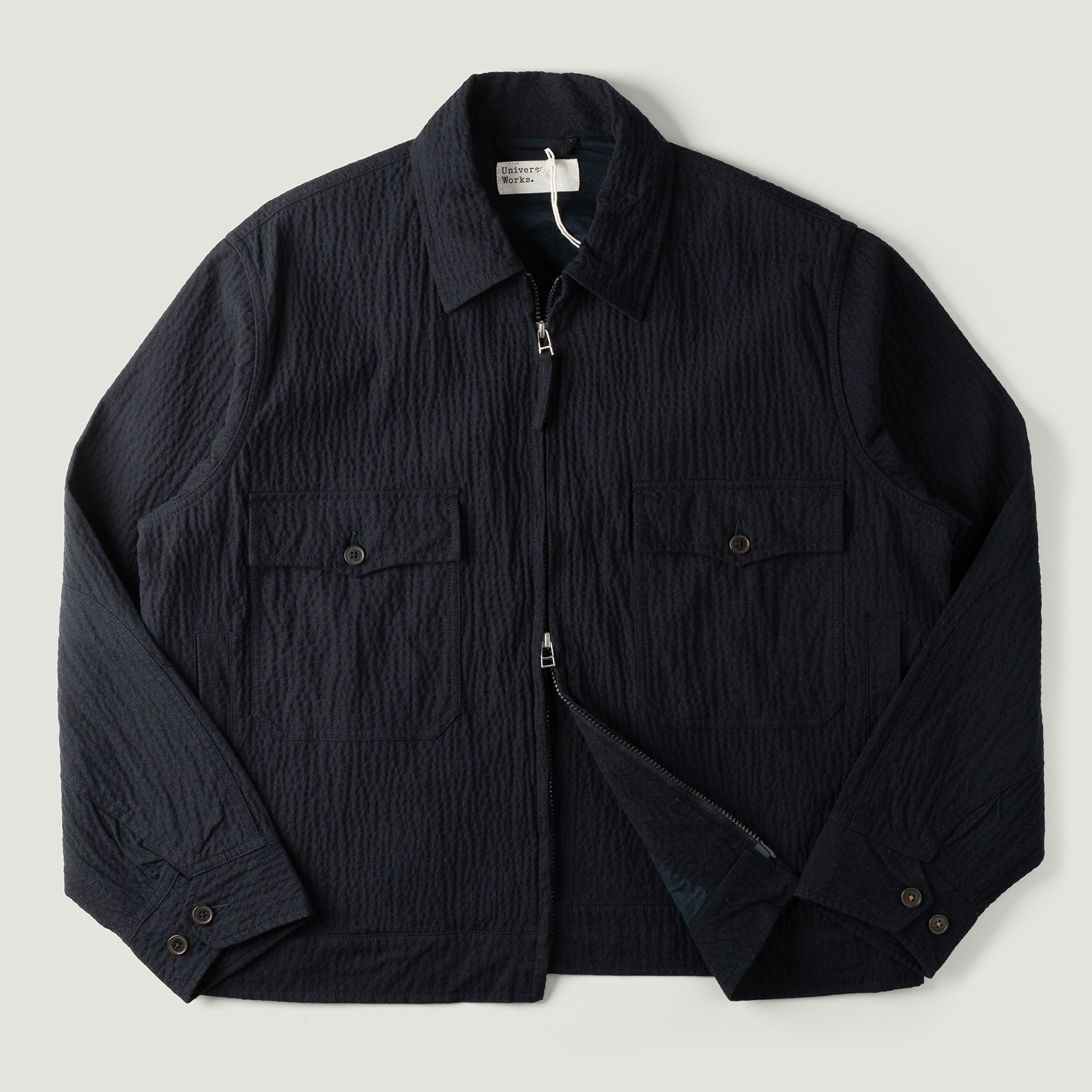 Vignette_Image_Flaneurs_veste courte UNIVERSAL WORKS E130 Jacket Ospina Cotton Dark Navy