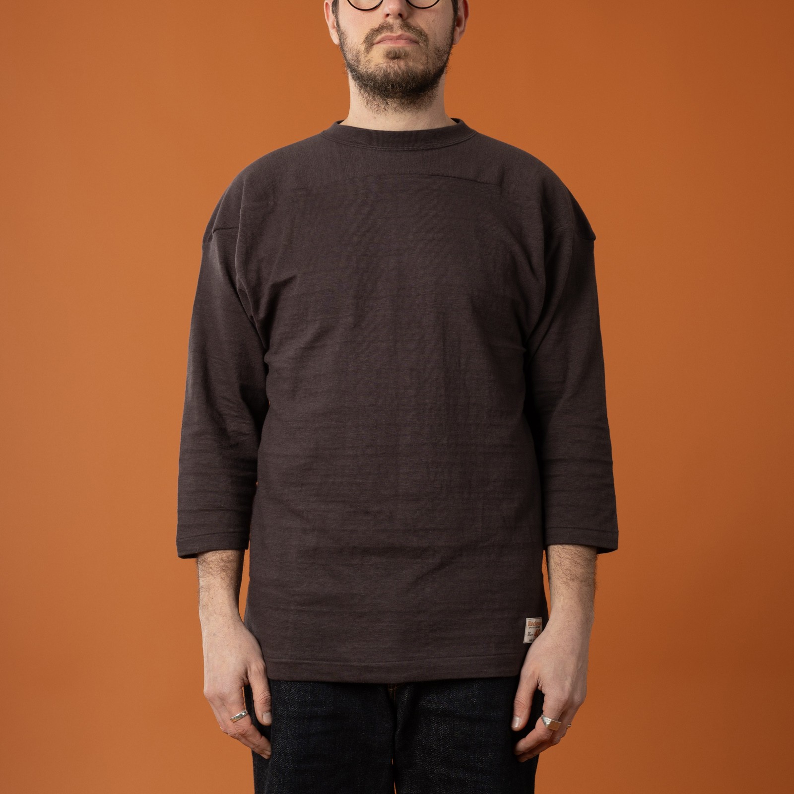 front-facing image featuring loafers and a WAREHOUSE & CO. three-quarter-sleeve t-shirt in sumikuro color