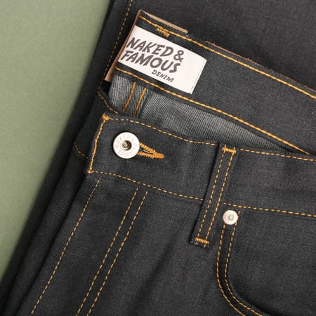 NAKED & FAMOUS SuperGuy Deep Indigo Stretch Selvedge laid flat photo