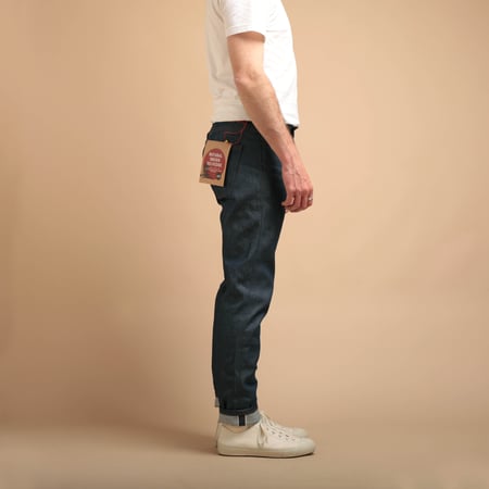 NAKED & FAMOUS SuperGuy Natural Indigo Selvedge jeans worn on the side