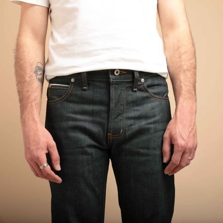 NAKED & FAMOUS SuperGuy Left Hand Twill Selvedge jeans worn in front by photo flâneurs