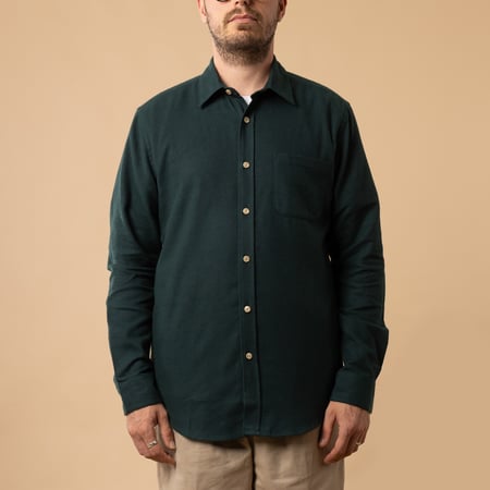 PORTUGUESE FLANNEL Teca Shirt in Green with front closed, made of cotton.