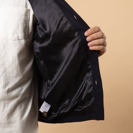 PORTUGUESE FLANNEL Wool Field Overshirt in Navy color with lining detail.