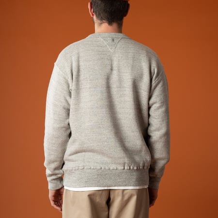Image of flâneurs wearing a DUBBLE WORKS Sweatshirt with Loop Wheel details, viewed from the back.