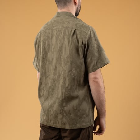 Flâneurs Image Wearing PORTUGUESE FLANNEL Summer Paisley Short Sleeve Olive on their Backs