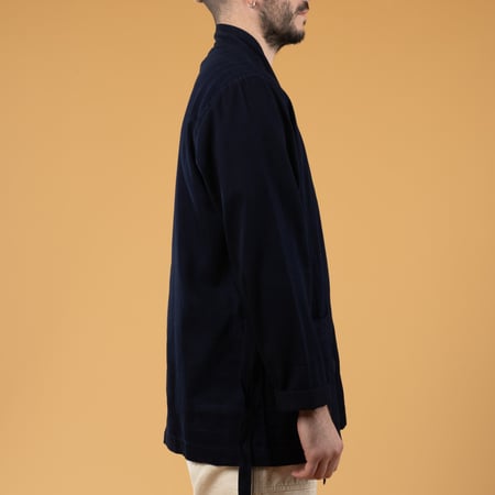 Image of flâneurs UNIVERSAL WORKS Kyoto Work Jacket in Indigo Herringbone worn in profile