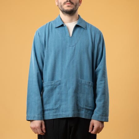 UNIVERSAL WORKS Smock Overshirt in Washed Indigo Herringbone Denim, front view image with loafers (2)