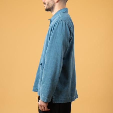 UNIVERSAL WORKS Smock Overshirt in Washed Indigo Herringbone Denim, front view image with loafers (3)
