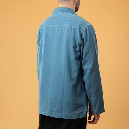 UNIVERSAL WORKS Smock Overshirt in Washed Indigo Herringbone Denim, front view image, loafers (4)