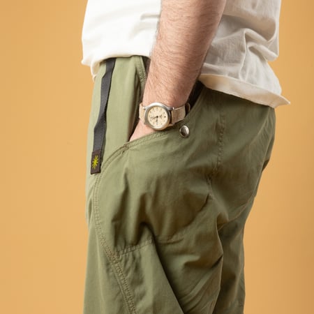 GOHEMP High Explorer Pants Olive Green with side pocket, worn by urban wanderers.