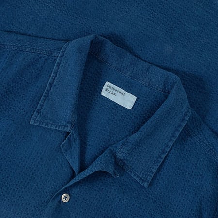 UNIVERSAL WORKS Road Shirt in Washed Indigo Seersucker with Laydown Collar