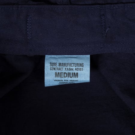 détail tag flâneurs veste XX DEVELOPMENT SURE MFG Anoraks nasvy
