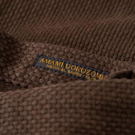 detail tag flaneurs STUDIO D'ARTISAN 1914 17oz Amami Oshima Mud-Dyed Sashiko Dark Brown