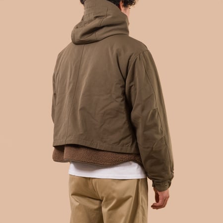 flaneurs Frizmworks Smock Hooded Parka Olive worn back