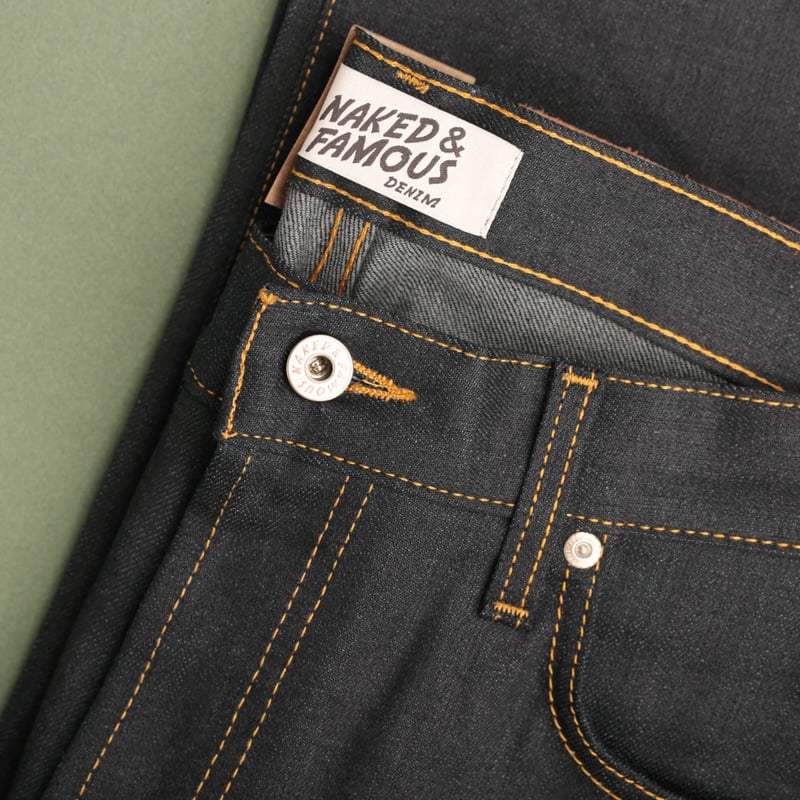 NAKED & FAMOUS SuperGuy Deep Indigo Stretch Selvedge laid flat photo