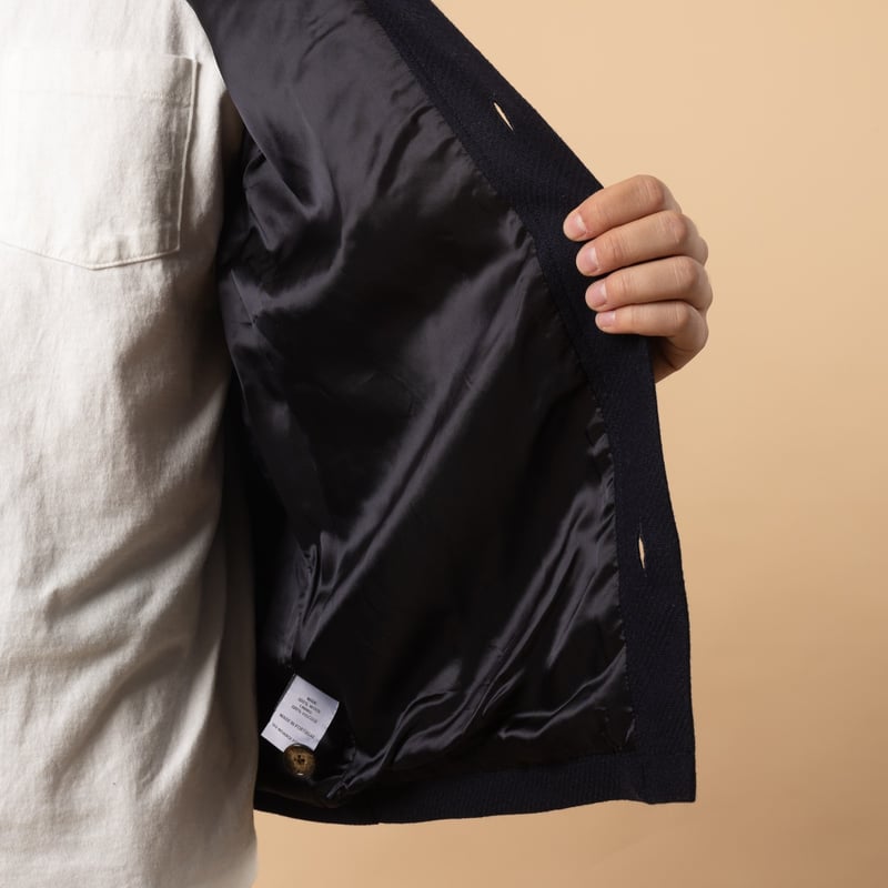 PORTUGUESE FLANNEL Wool Field Overshirt in Navy color with lining detail.
