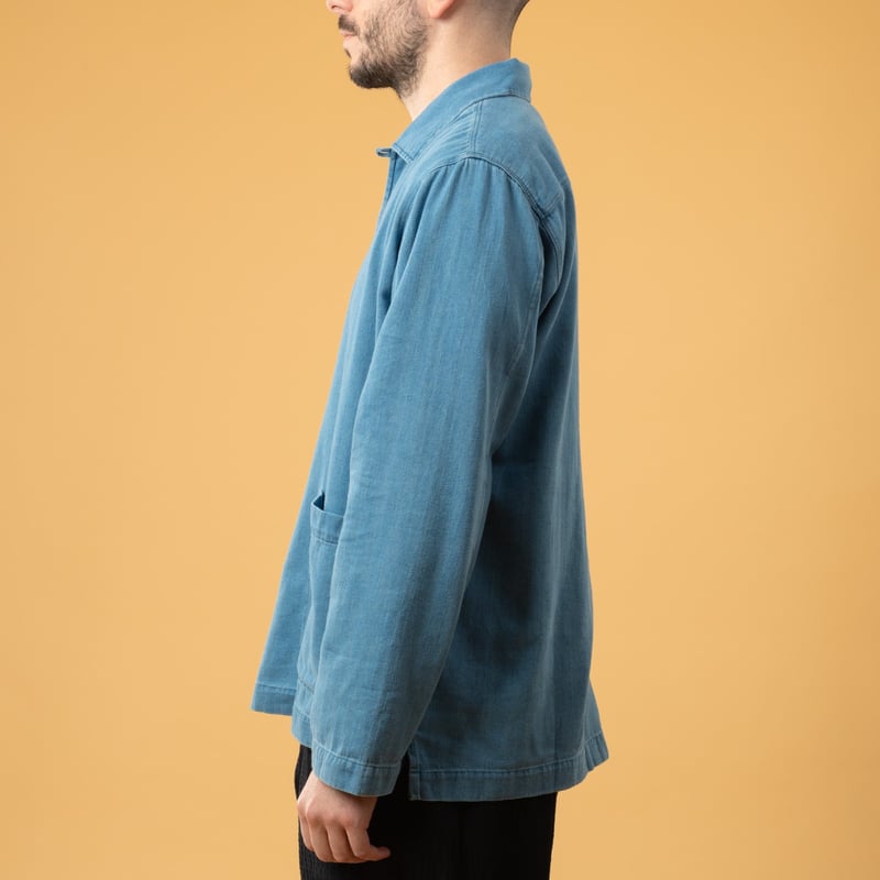 UNIVERSAL WORKS Smock Overshirt in Washed Indigo Herringbone Denim, front view image with loafers (3)
