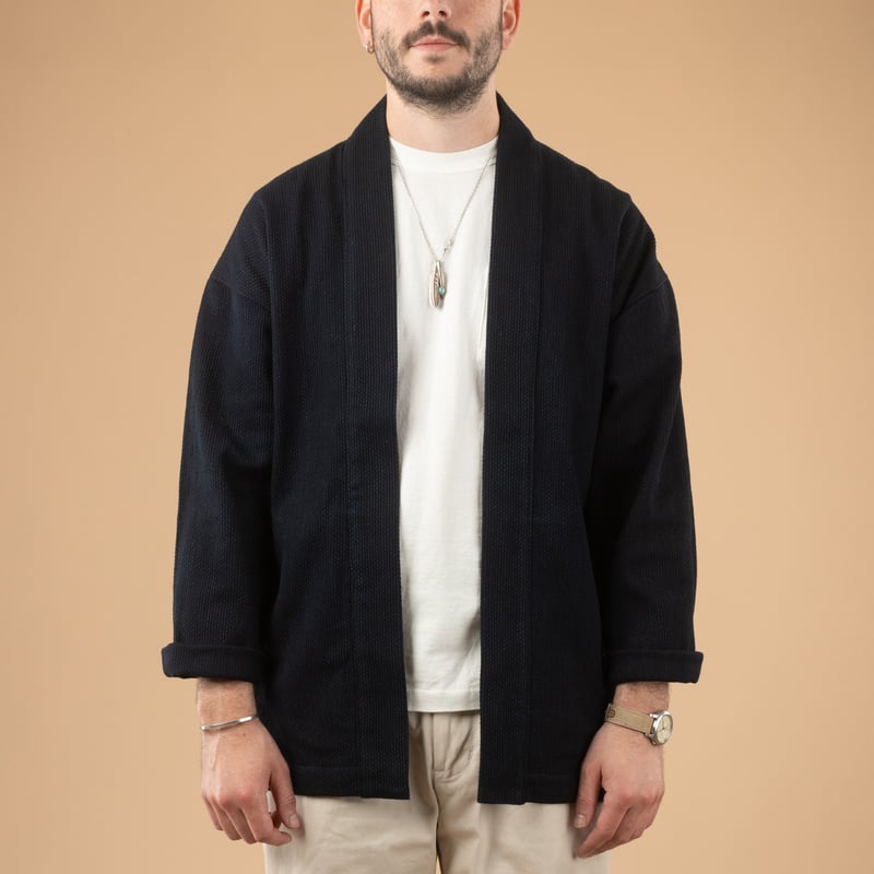 image of flâneurs wearing a front-facing JAPAN BLUE JEANS Indigo Sashiko Haori jacket